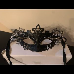 Masquerade mask with rhinestone jewels.  Very good quality.